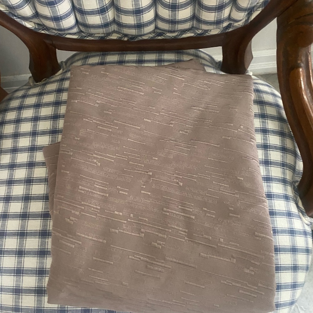New without tags taupe colored tablecloth display on a 48 round inch table
